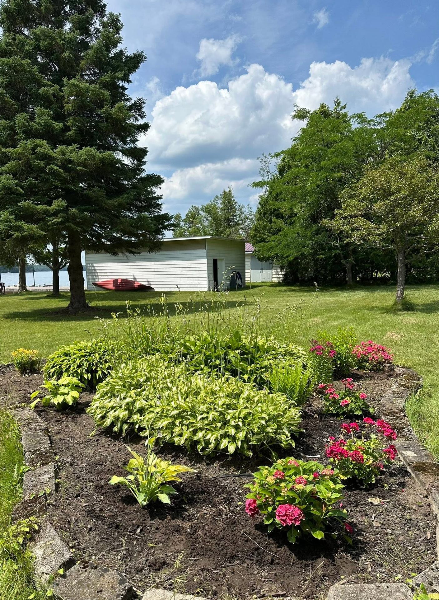 Lakeside garden bed by Nolan Landscaping